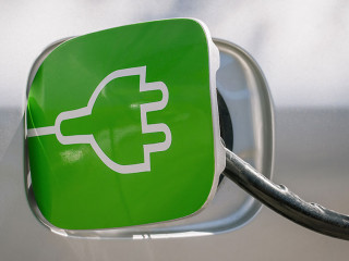 charging the electric car in station. renewable energy in transp