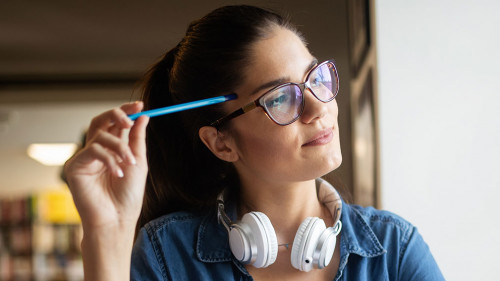 Beautiful student woman studying and learning at college