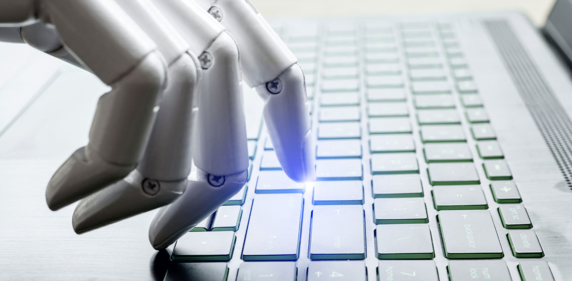 Robot hand pressing computer keyboard enter