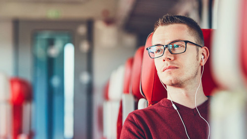 Young man traveling by train
