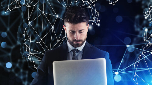 Businessman works with laptop and internet network