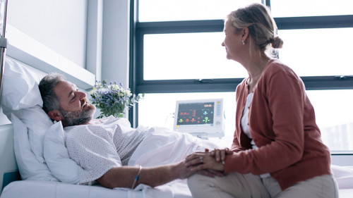 Wife visiting husband in hospital