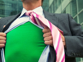 Business superhero ripping off his suit to reveal his green eco-