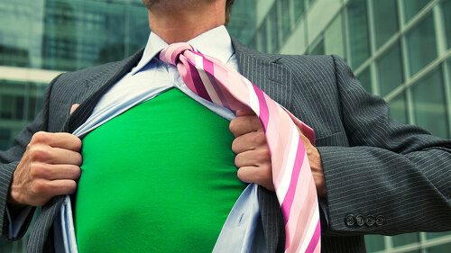 Business superhero ripping off his suit to reveal his green eco-