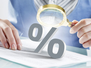 Prozentzeichen-unter-Lupe-101960295-FO-Sergey-Nivens