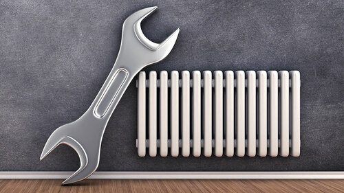 Schraubenschluessel-an-Heizkoerper-95280548-FO-fotovika