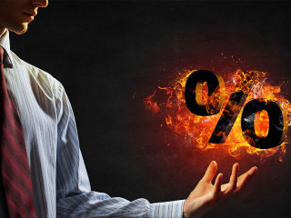 brennendes-prozentzeichen-mann-106109753-FO-Sergey-Nivens