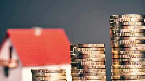 Haus-Muenzstapel-141244556-FO-Eisenhans