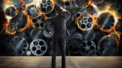 Anzugtraeger-brennende-Zahnraeder-129365183-FO-alphaspirit