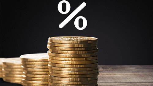 Prozent-Symbol-ueber-Muenzstapeln-206754724-FO-BillionPhotos-com