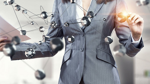 Anzugtraegerin-Papier-Netzwerk-121987855-FO-Sergey-Nivens